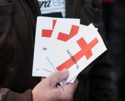 person holding white and red box